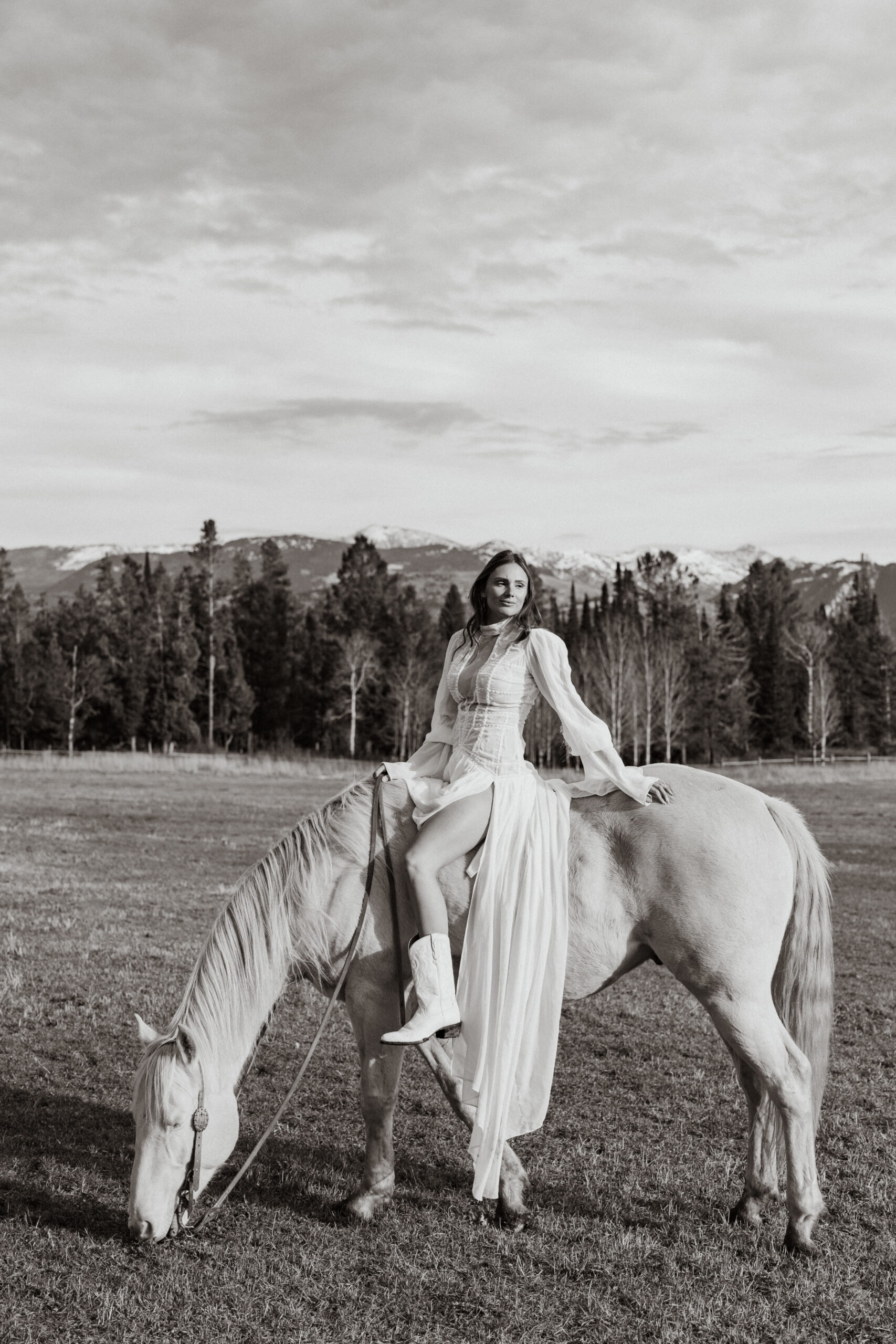 Bridal portrait with horse at a private ranch in Wilson, Wyoming photographed by Alexandria Rraci of Valley & Veil, a Jackson Hole wedding photgorapher.