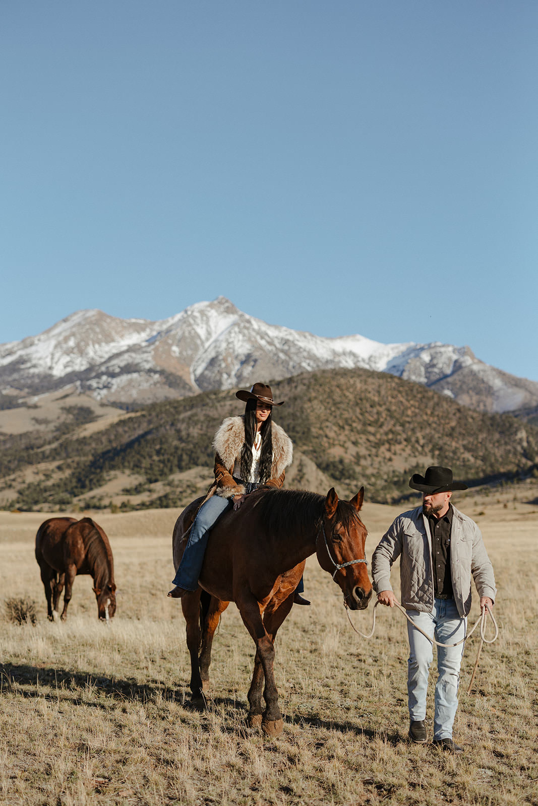 couple and horses during a Paradise Valley Montana engagement session with Valley & Veil